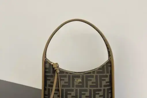Fendi Zucca Baguette Small in signature FF canvas with leather trim – luxury Fendi handbag with iconic monogram design.