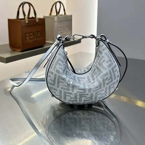 Fendi Baguette Hobo Bag Silver 2026 | Drip Kickz Fendi Baguette Hobo Bag Silver in jacquard with metallic finish – luxury designer handbag with iconic Fendi style.