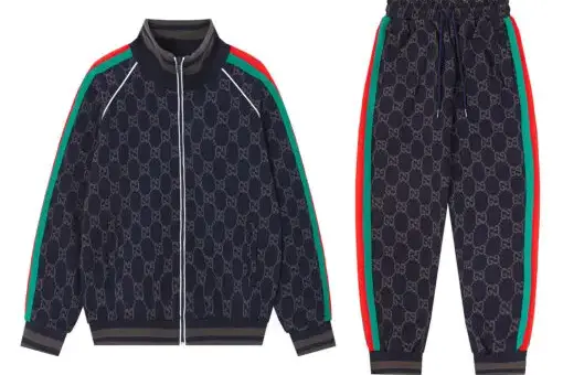 Gucci GG Supreme Tracksuit Dark Blue with iconic monogram and web stripes – luxury streetwear set with jacket and tapered pants.