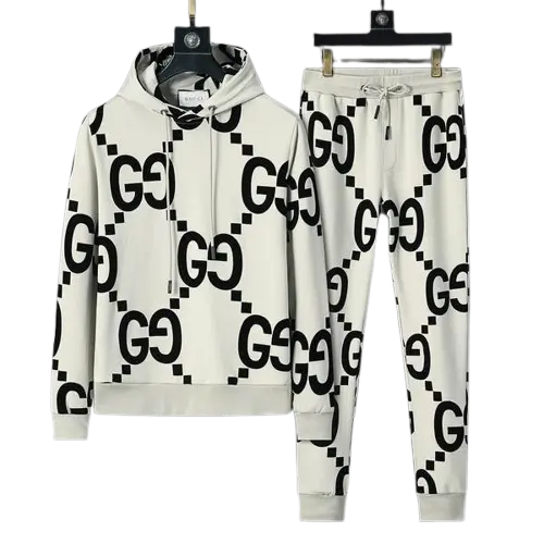 Gucci Oversized GG Logo Tracksuit 2026 | Drip Kickz Gucci Oversized GG Logo Tracksuit in white with black monogram – luxury oversized streetwear set with jacket and pants.