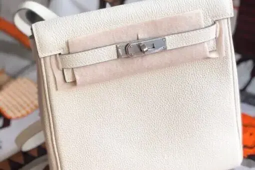 Hermes Kelly Ado Backpack White in premium leather with palladium hardware – a luxury Hermès backpack inspired by the classic Kelly Bag.