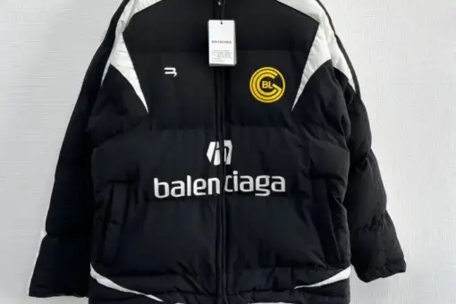 Balenciaga BL Puffer Jacket Black front view – black padded puffer jacket with Balenciaga logo, oversized luxury streetwear