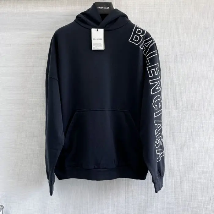 Balenciaga Hoodie Logo Sleeve Logo Black 2026 | Drip Kickz Balenciaga Hoodie Logo Sleeve Logo Black front view – black oversized hoodie with Balenciaga sleeve logo, luxury streetwear design