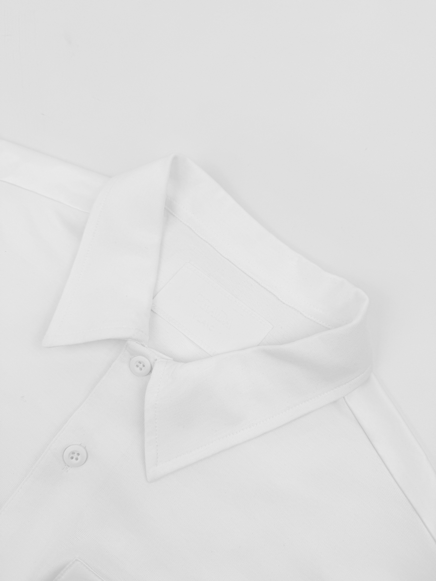 Prada Re-Nylon Pocket Polo Shirt Practical Luxury White 2026 | Drip Kickz Prada Re-Nylon Pocket Polo Shirt Practical Luxury White - Image 2