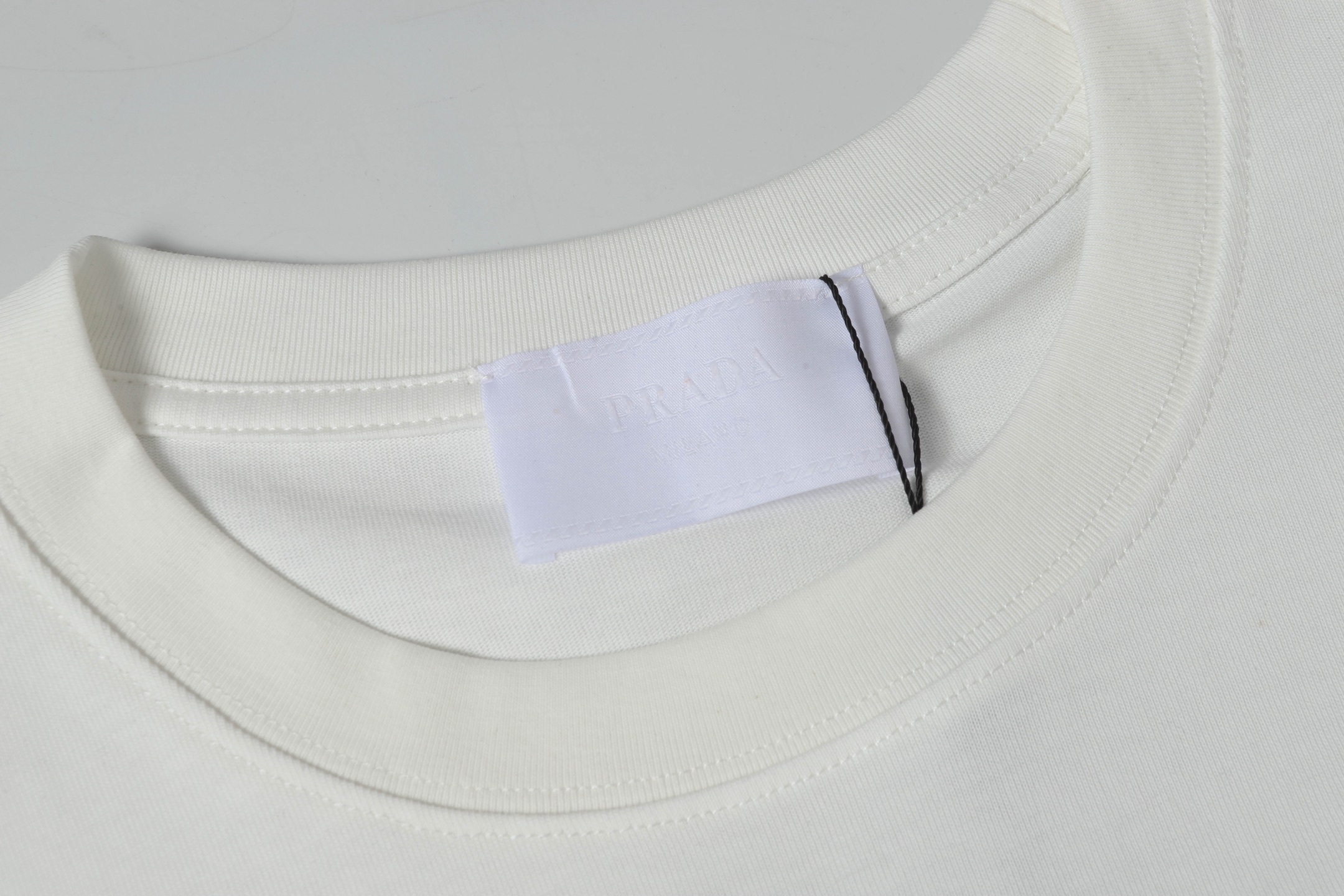 Prada Men’s Cotton T-Shirt Distinctive Black Re-Nylon Pocket White 2026 | Drip Kickz Prada Men’s Cotton T-Shirt Distinctive Black Re-Nylon Pocket White - Image 3