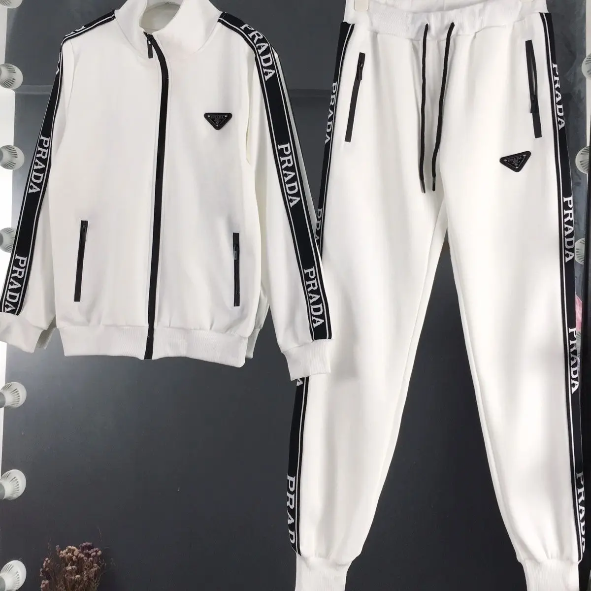 Prada Branded Tracksuits Featuring Black Side Stripes 2026 | Drip Kickz Prada Branded Tracksuits Featuring Black Side Stripes